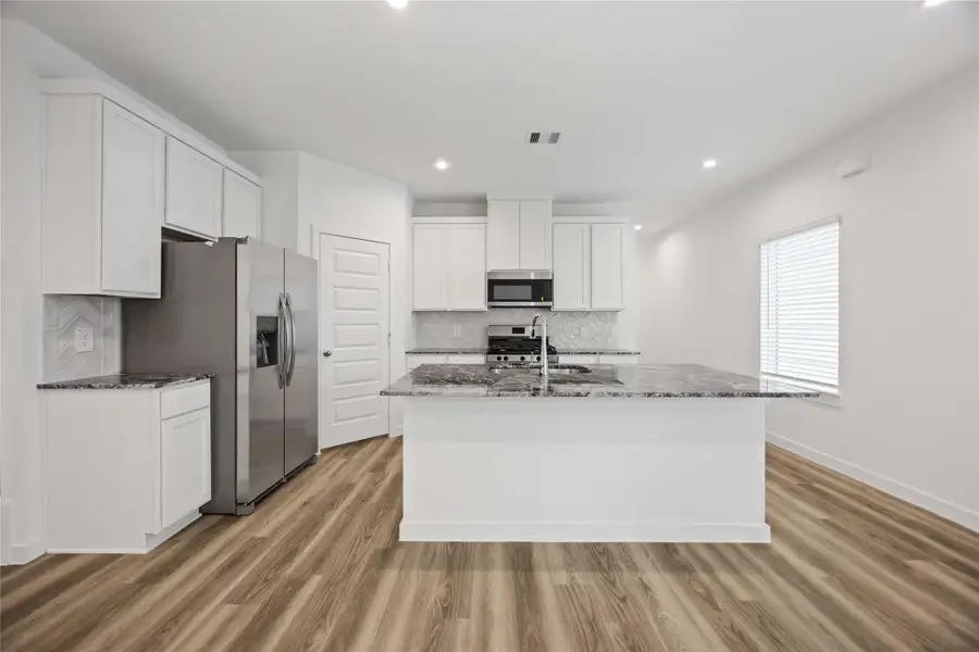 Furnished interior view inside a new home in Grand West, Houston (Image 3).