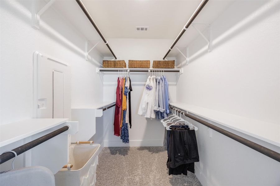 Walk in closet with light carpet Walk in closet with light carpet