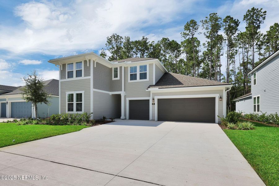 Front exterior of a new home in Trailmark - Phase 10, St. Augustine, FL, highlighting curb appeal (Image 2). Front exterior of a new home in Trailmark - Phase 10, St. Augustine, FL, highlighting curb appeal (Image 2).