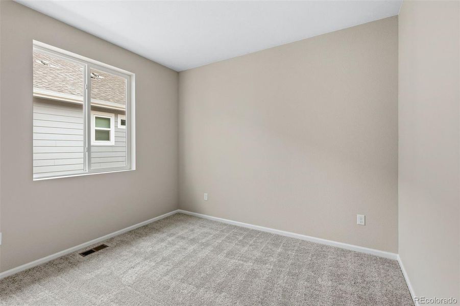 Spacious, unfurnished interior of a new home in The Cottages Collection at Ridgeline Vista, Brighton (Image 16).