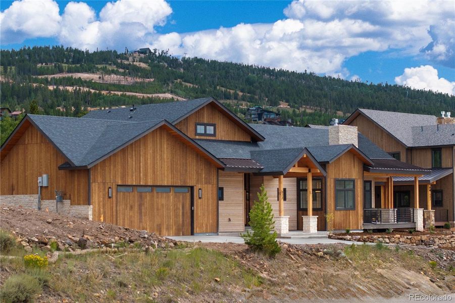 Front exterior of a new home in , Granby, CO, highlighting curb appeal (Image 1).