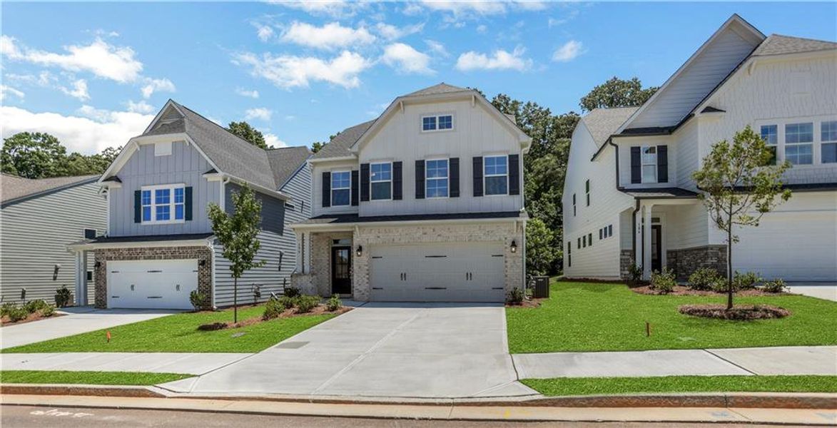 Front exterior of a new home in Villas at Dawsonville, Dawsonville, GA, highlighting curb appeal (Image 20). Front exterior of a new home in Villas at Dawsonville, Dawsonville, GA, highlighting curb appeal (Image 20).