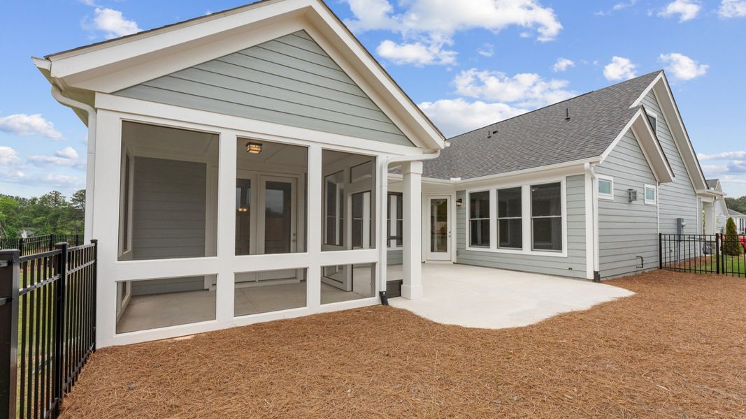 Exterior details and patio area of a home in The Courtyards at Bailey Farms, Dacula (Image 18).