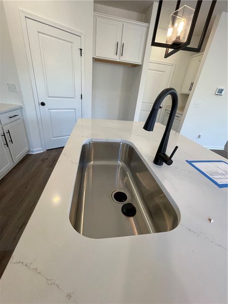 This modern kitchen features a spacious sink and e