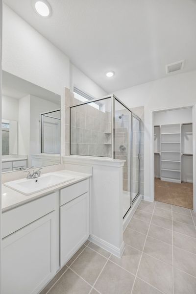 Primary Bathroom in the Magnolia home plan by Trophy Signature Homes – REPRESENTATIVE PHOTO