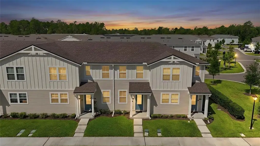 Front exterior of a new home in , St. Johns, FL, highlighting curb appeal (Image 22). Front exterior of a new home in , St. Johns, FL, highlighting curb appeal (Image 22).