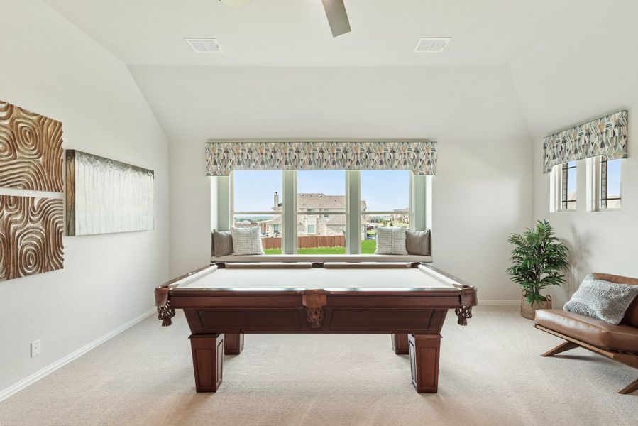 Game room with wood pool table, vaulted ceiling, window seat, and carpet flooring