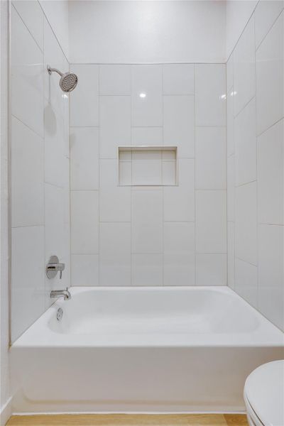 Bathroom with shower / tub combination and toilet Bathroom with shower / tub combination and toilet
