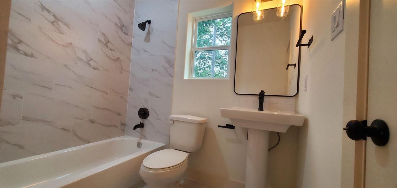 Second bathroom upstairs with a  tub.