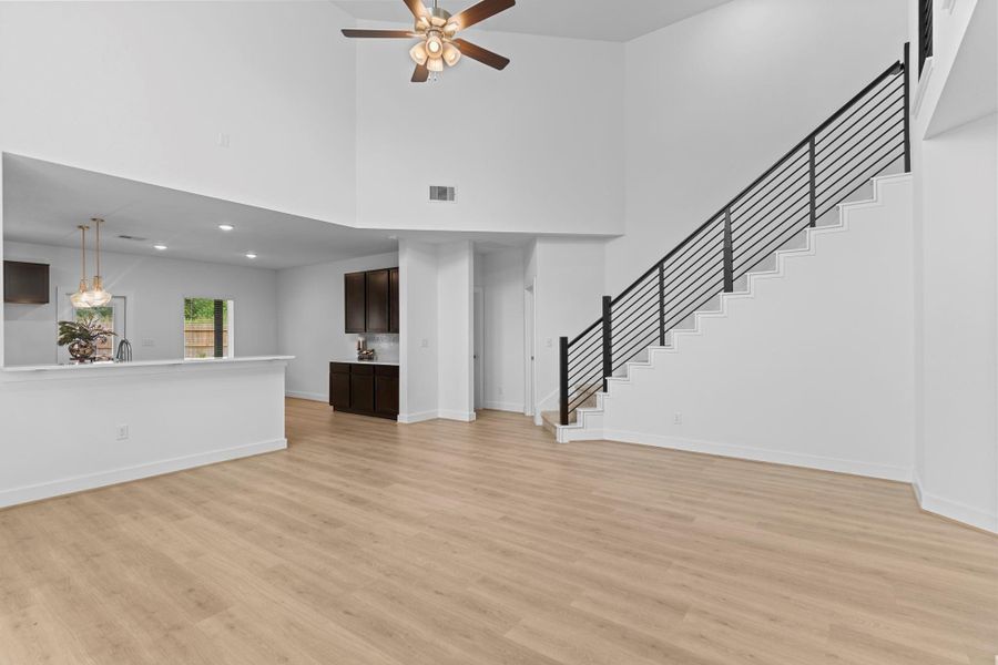 An entertainer’s dream—this open-concept living room flows seamlessly into the gourmet kitchen, with beautiful sightlines, modern lighting, and elegant finishes throughout. **Image Representative of Plan Only and May Vary as Built**.