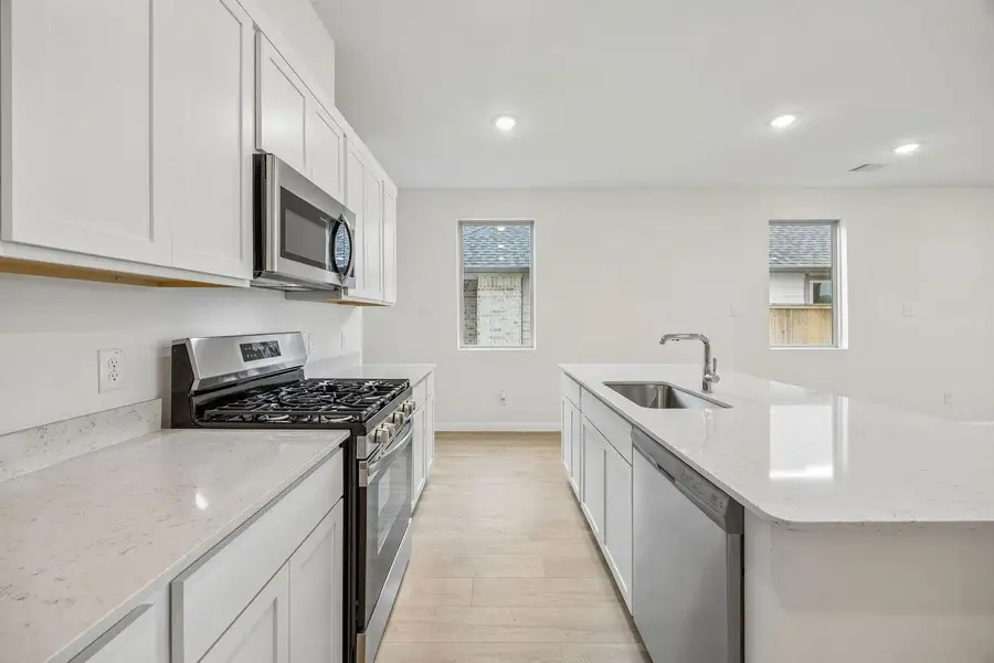 Kitchen in the Magnolia home plan by Trophy Signature Homes – REPRESENTATIVE PHOTO Kitchen in the Magnolia home plan by Trophy Signature Homes – REPRESENTATIVE PHOTO