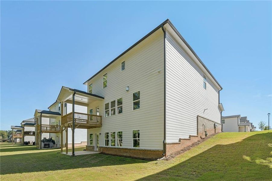 Front exterior of a new home in Martin Springs - Estate Series, Lawrenceville, GA, highlighting curb appeal (Image 22). Front exterior of a new home in Martin Springs - Estate Series, Lawrenceville, GA, highlighting curb appeal (Image 22).