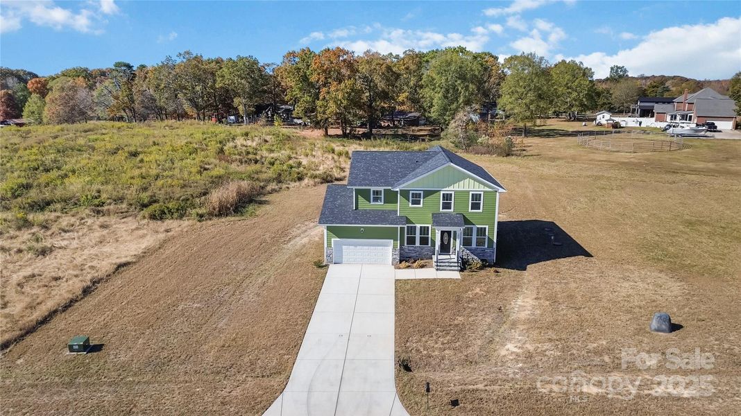 Front exterior of a new home in , Monroe, NC, highlighting curb appeal (Image 21).
