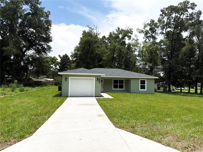 Front exterior of a new home in , Ocala, FL, highlighting curb appeal (Image 22). Front exterior of a new home in , Ocala, FL, highlighting curb appeal (Image 22).