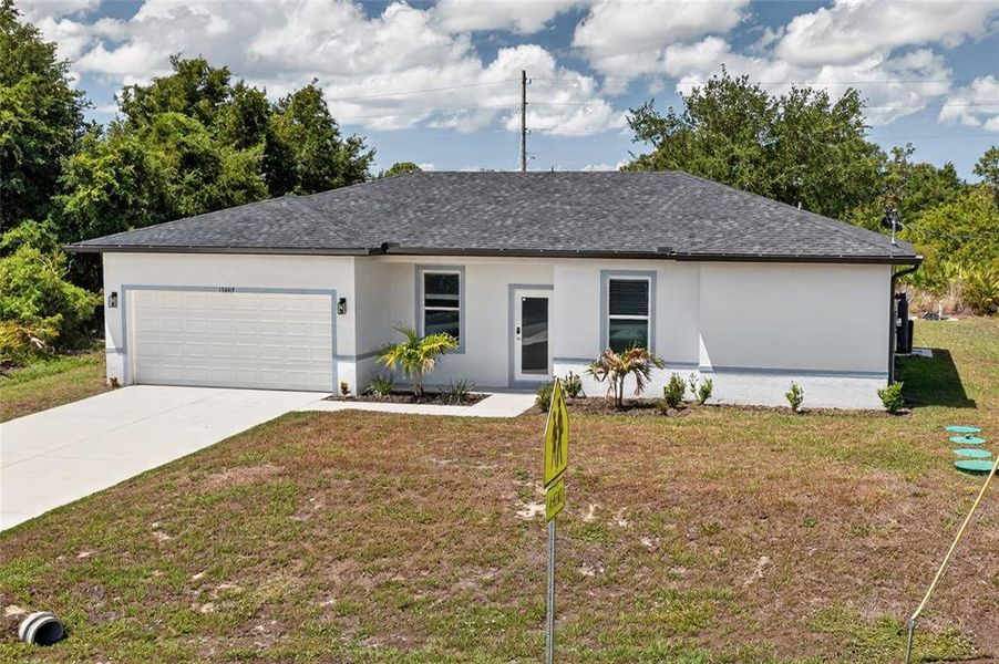 Front exterior of a new home in , Port Charlotte, FL, highlighting curb appeal (Image 21). Front exterior of a new home in , Port Charlotte, FL, highlighting curb appeal (Image 21).