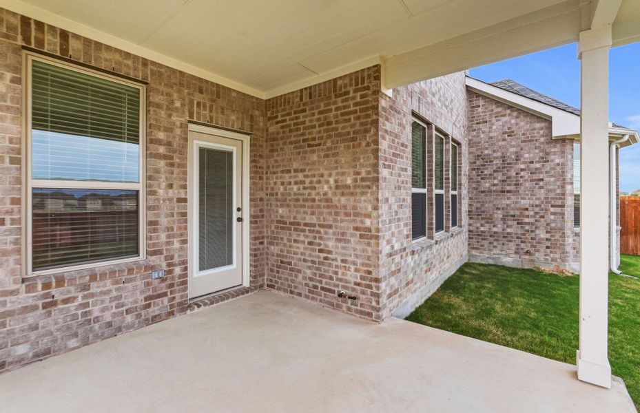 Exterior details and patio area of a home in Saddleback at Santa Rita Ranch, Liberty Hill (Image 4).