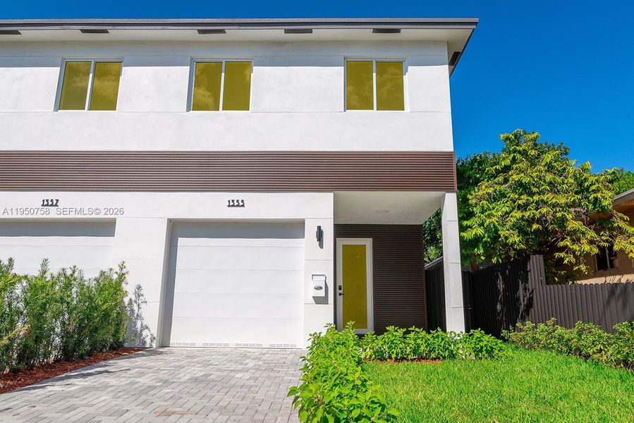 Front exterior of a new home in , Miami, FL, highlighting curb appeal (Image 21).