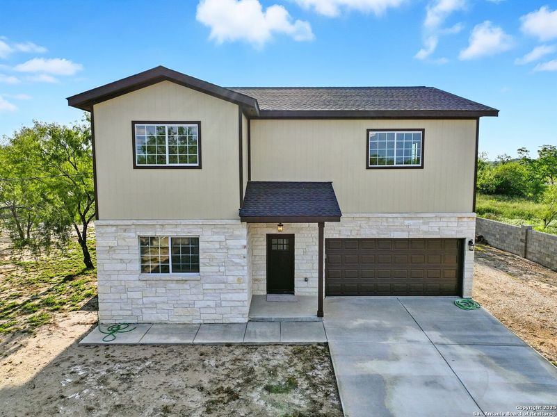 Front exterior of a new home in , Lytle, TX, highlighting curb appeal (Image 1). Front exterior of a new home in , Lytle, TX, highlighting curb appeal (Image 1).