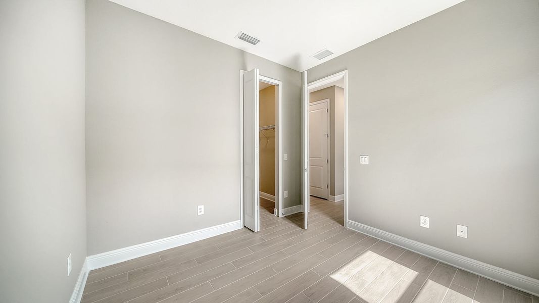 Spacious, unfurnished interior of a new home in Vicenza Real Estate and Homes for Sale in North Venice, FL - Neal Communities, Venice (Image 36).