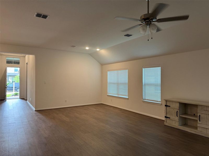 Bright and airy living room features expansive windows and seamless flow into the kitchen and dining areas. Bright and airy living room features expansive windows and seamless flow into the kitchen and dining areas.