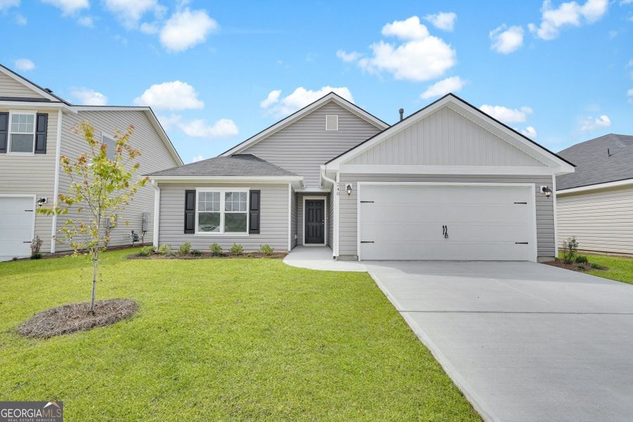 Front exterior of a new home in Heritage at New Riverside, Bluffton, SC, highlighting curb appeal (Image 1). Front exterior of a new home in Heritage at New Riverside, Bluffton, SC, highlighting curb appeal (Image 1).