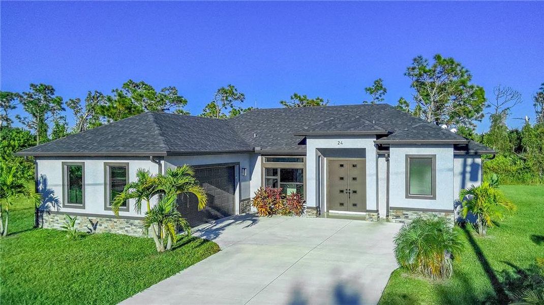 Front exterior of a new home in , Rotonda West, FL, highlighting curb appeal (Image 1). Front exterior of a new home in , Rotonda West, FL, highlighting curb appeal (Image 1).
