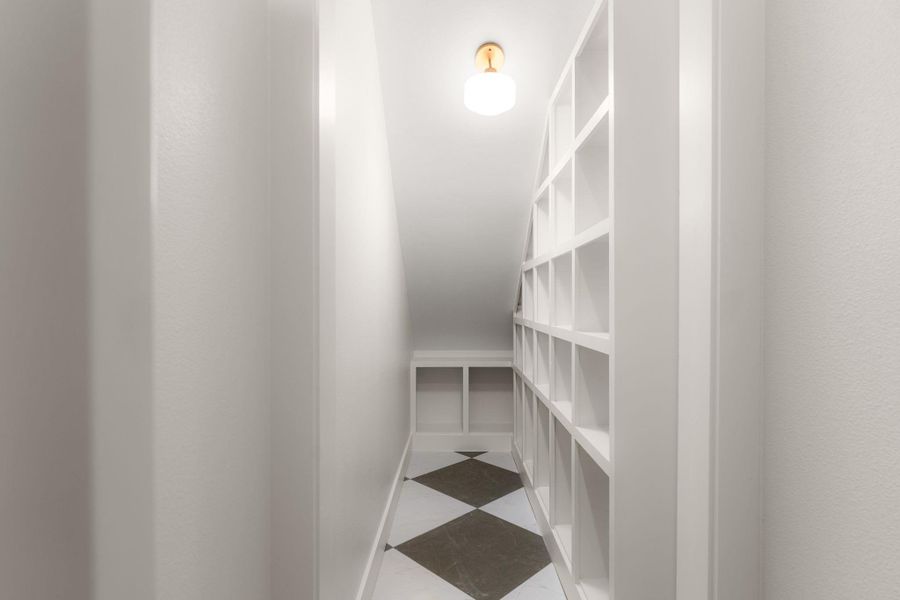 Smartly designed attic space with built-in shelving, providing ample storage for any homeowner.
