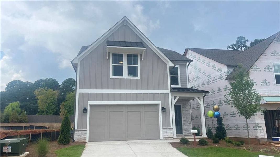 Front exterior of a new home in , Canton, GA, highlighting curb appeal (Image 1). Front exterior of a new home in , Canton, GA, highlighting curb appeal (Image 1).