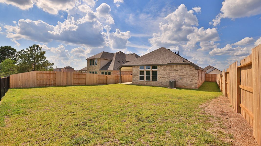 Exterior details and patio area of a home in Grand Magnolia, Magnolia (Image 20).