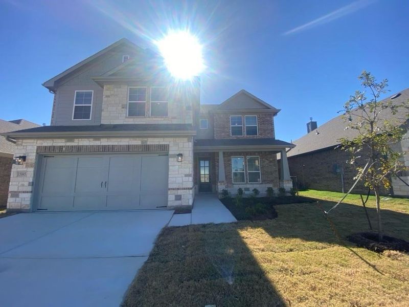 Front exterior of a new home in Morningstar, Aledo, TX, highlighting curb appeal (Image 2).