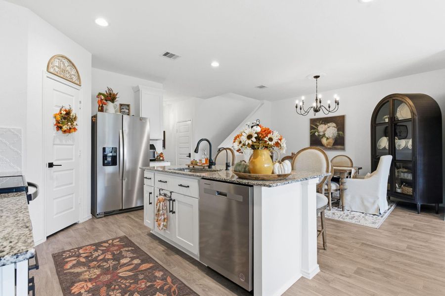 Gourmet kitchen featuring granite countertops, stainless steel appliances, and a large eat-in island. Gourmet kitchen featuring granite countertops, stainless steel appliances, and a large eat-in island.