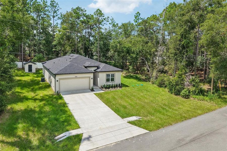 Front exterior of a new home in , Inverness, FL, highlighting curb appeal (Image 24).