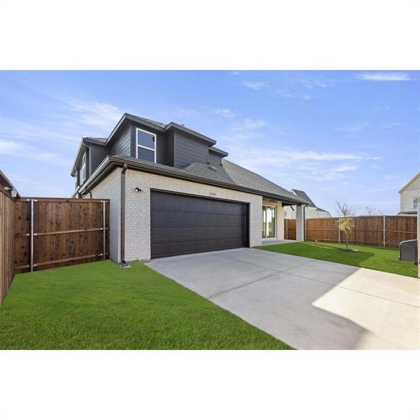 Front exterior of a new home in Trails at Cottonwood Creek, Rowlett, TX, highlighting curb appeal (Image 17). Front exterior of a new home in Trails at Cottonwood Creek, Rowlett, TX, highlighting curb appeal (Image 17).