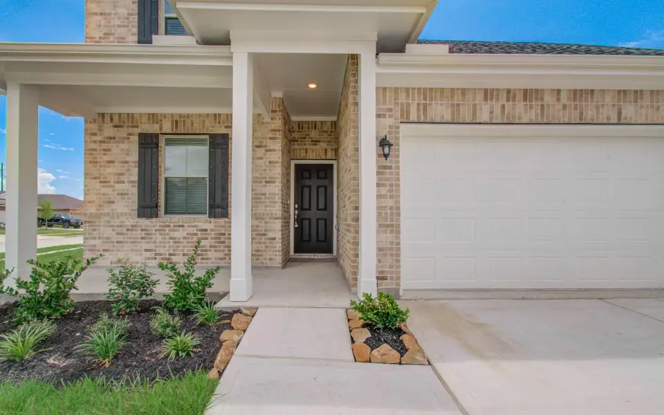Exterior details and patio area of a home in Legends Bay, Baytown (Image 24).