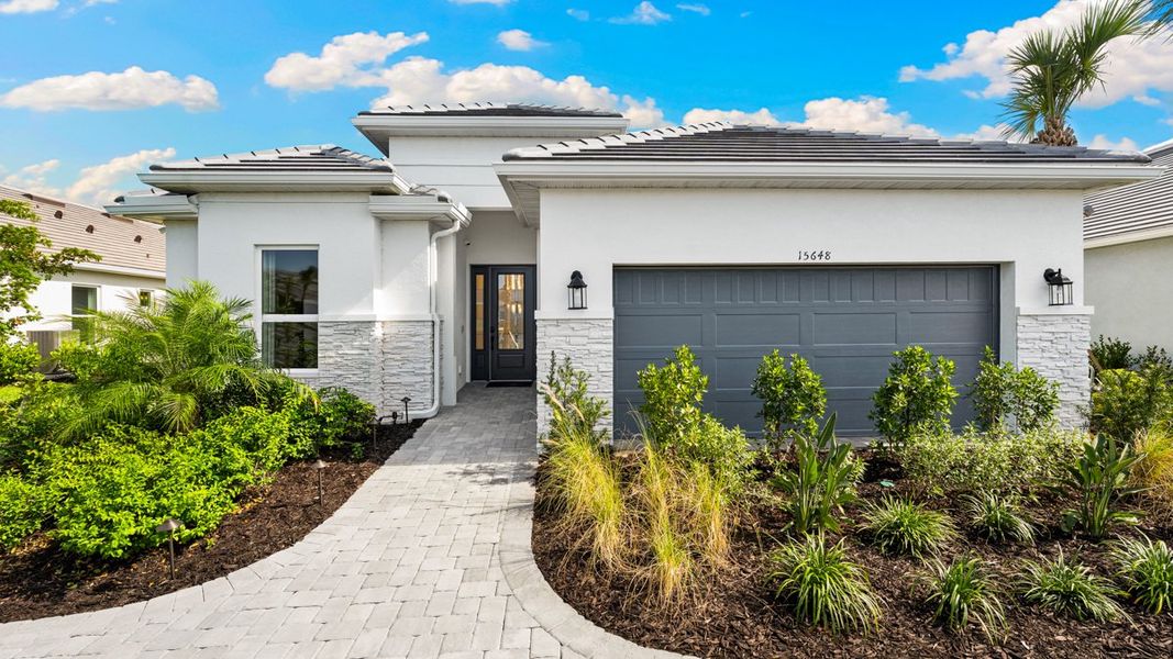 Representative exterior photo of a completed home built from the Lavello by Taylor Morrison in Esplanade by the Islands, Naples, FL (Image 1). Representative exterior photo of a completed home built from the Lavello by Taylor Morrison in Esplanade by the Islands, Naples, FL (Image 1).