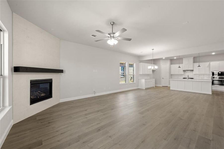 The gas fireplasces anchors the room in this open concept floorplan. The gas fireplasces anchors the room in this open concept floorplan.