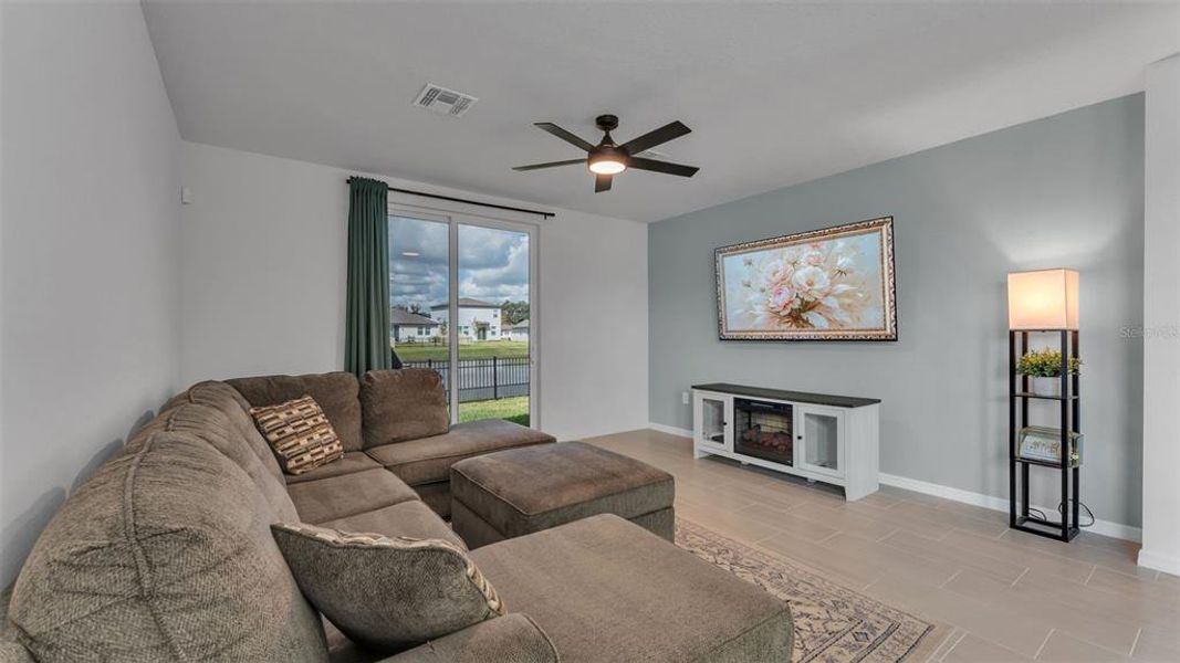 Furnished interior view inside a new home in The Grove at Stuart Crossing - Premier Series, Bartow (Image 18).