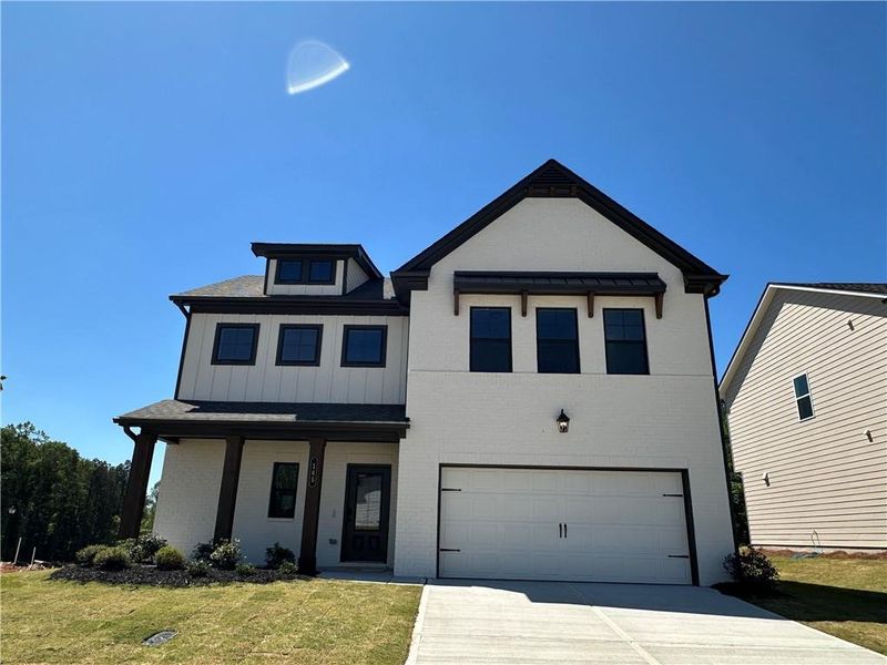 Front exterior of a new home in Summerlin, Winder, GA, highlighting curb appeal (Image 23).