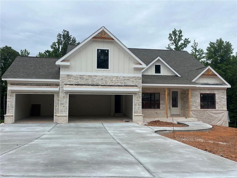 Front exterior of a new home in , Cumming, GA, highlighting curb appeal (Image 2). Front exterior of a new home in , Cumming, GA, highlighting curb appeal (Image 2).
