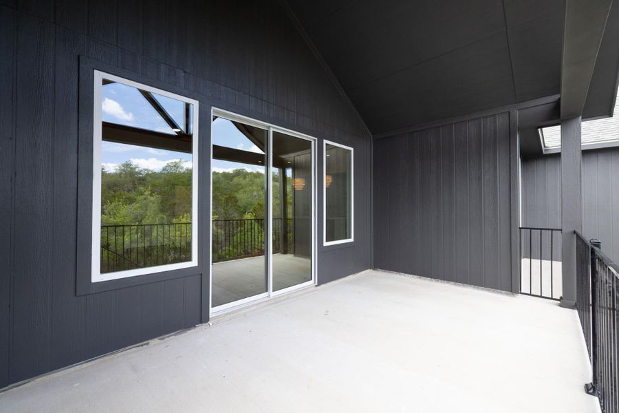 An inviting balcony space offers sweeping natural vistas.