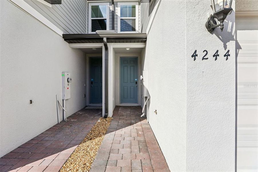 Exterior details and patio area of a home in The Meadow at Crossprairie Bungalows, St. Cloud (Image 33).