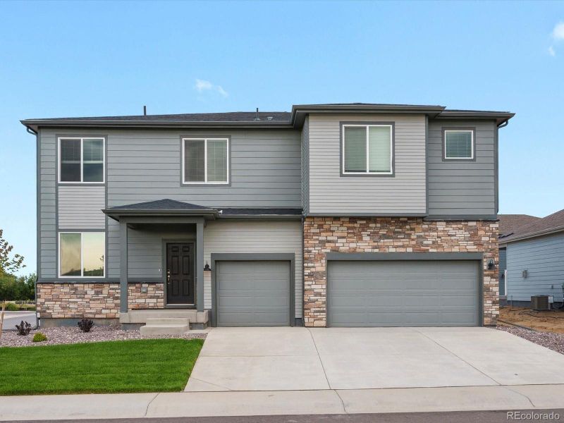 Front exterior of a new home in Poudre Heights: The Alpine Collection, Windsor, CO, highlighting curb appeal (Image 22).