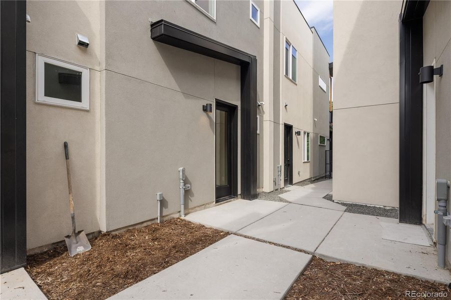 Backdoor with common area courtyard.  Don't miss the garage.