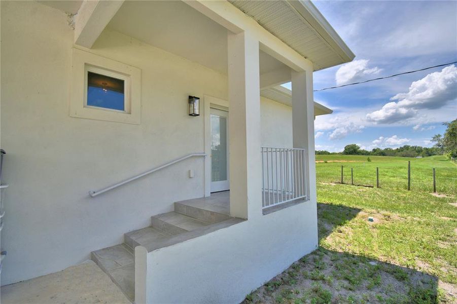 Exterior details and patio area of a home in , Polk City (Image 4).