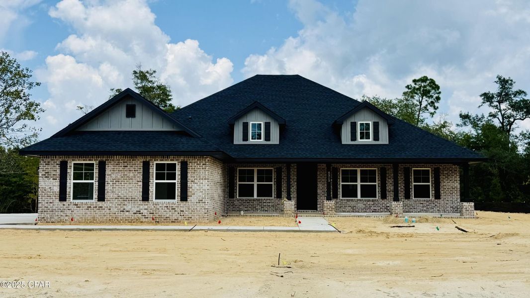 Front exterior of a new home in Cedar Creek at Deerpoint Lake, Panama City, FL, highlighting curb appeal (Image 1). Front exterior of a new home in Cedar Creek at Deerpoint Lake, Panama City, FL, highlighting curb appeal (Image 1).