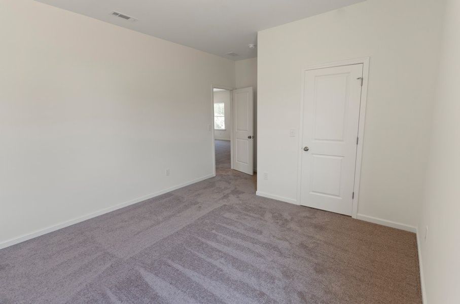 Spacious, unfurnished interior of a new home in The Exchange, Vass (Image 12).