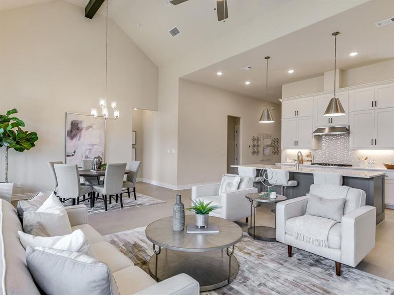 Light and bright, this inviting living room offers easy flow to the kitchen, dining area and outdoor patio.