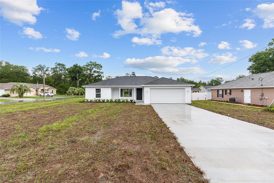 Front exterior of a new home in , Silver Springs, FL, highlighting curb appeal (Image 17).