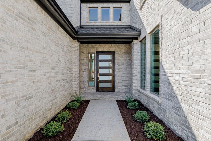 Representative exterior details of a home built from the 5032 by Tradition Homes in Lakewood at Brookhollow – 60′ Lots, Prosper (Image 3).