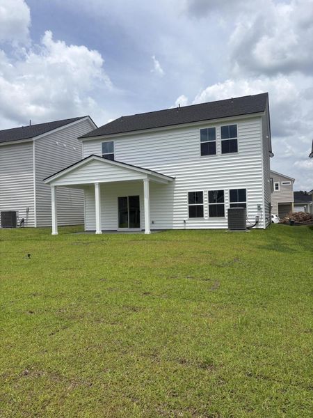 Exterior details and patio area of a home in Sweetgrass at Summers Corner, Summerville (Image 3).
